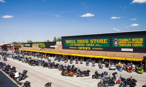 External view of Wall Drug Store Cafe during The Sturgis Rally with motorcycles in most parking spots